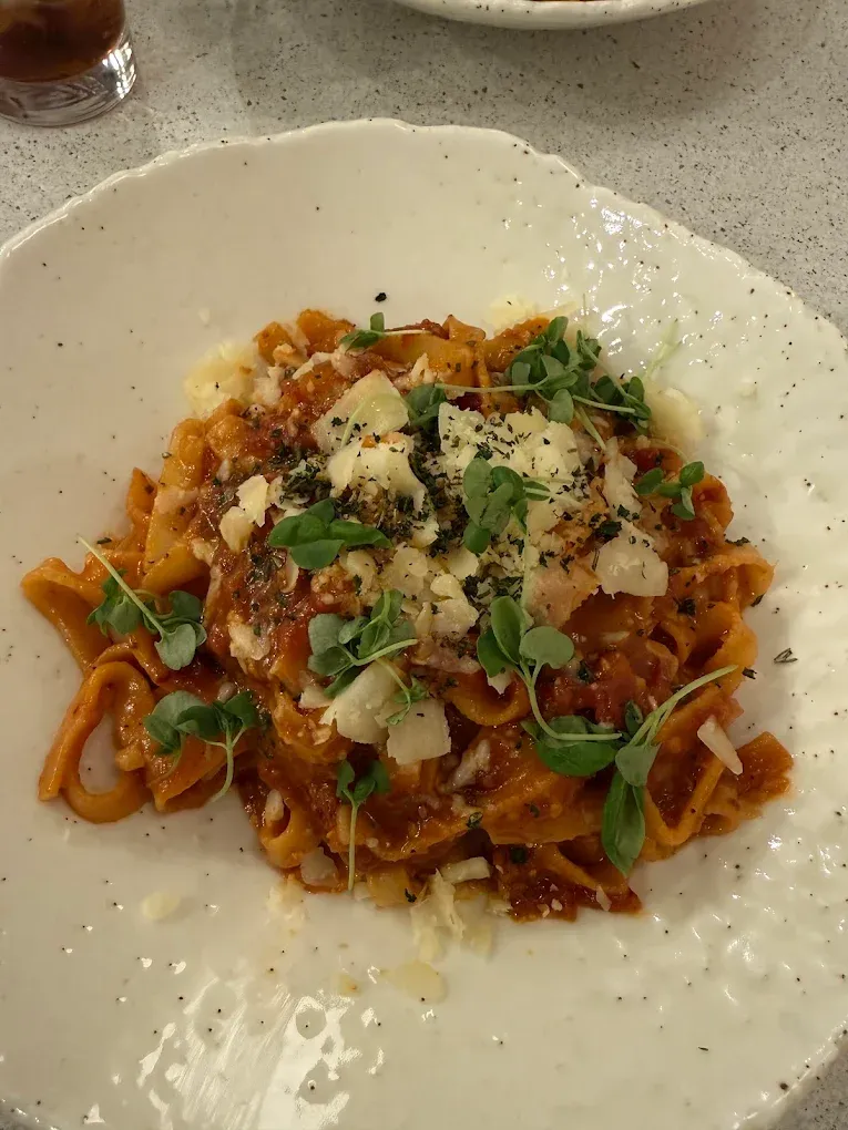 Classic Italian Bolognese pasta with rich meat sauce at Aglio Calgary